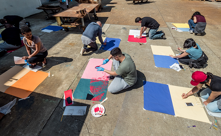 Students working on art outside