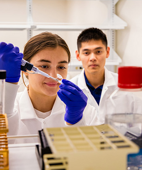 Two students working in a lab