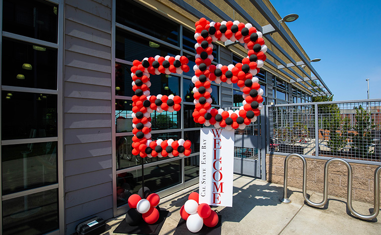 EB letters in red and black balloons