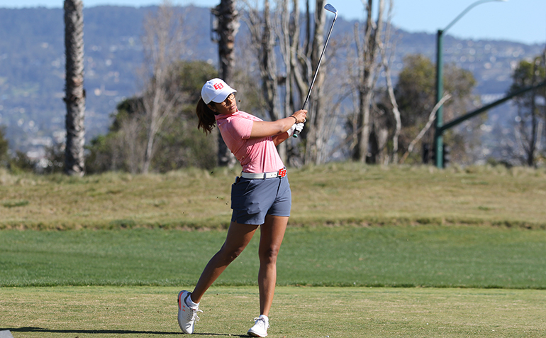 Female golfer drives the ball