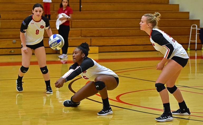 Volleyball player bumps ball