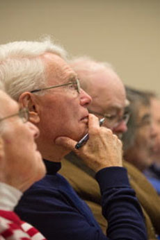 Older man pays attention in class