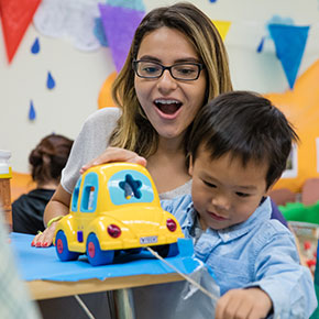 adult playing with child 