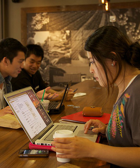 Female student working at laptop