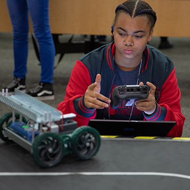  Teenager holds remote control