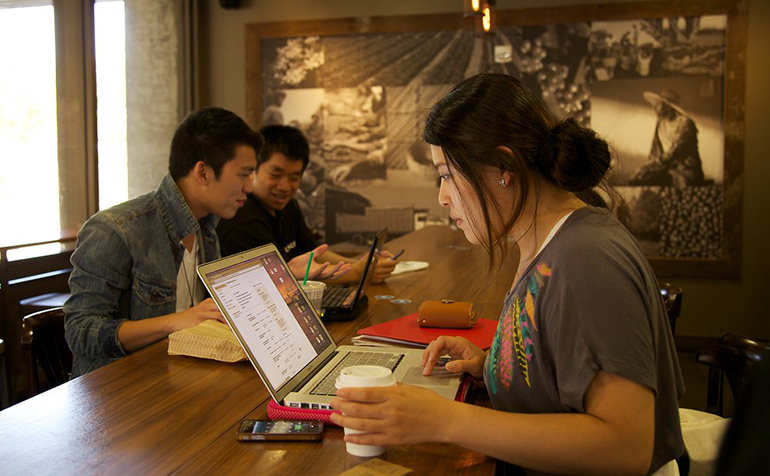 Female student working at laptop