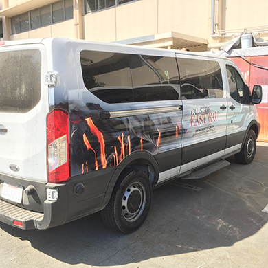  A white van with volcano lava graphic