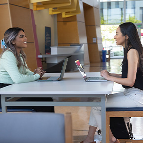 students sitting down at desk 