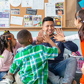 adult playing with kids 