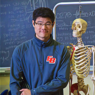 Professor uses skeleton model to teach