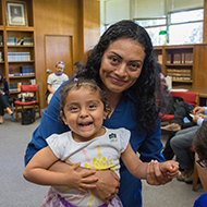 Mother poses with young daughter