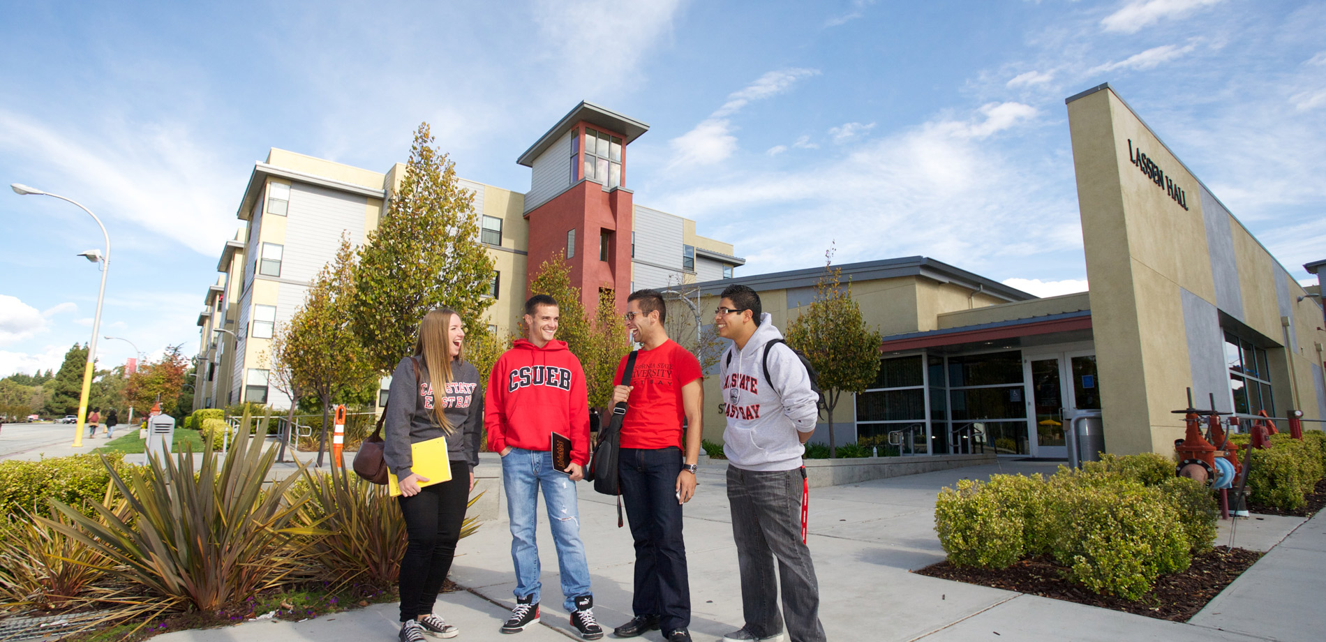 Residents standing in front of housing admin building