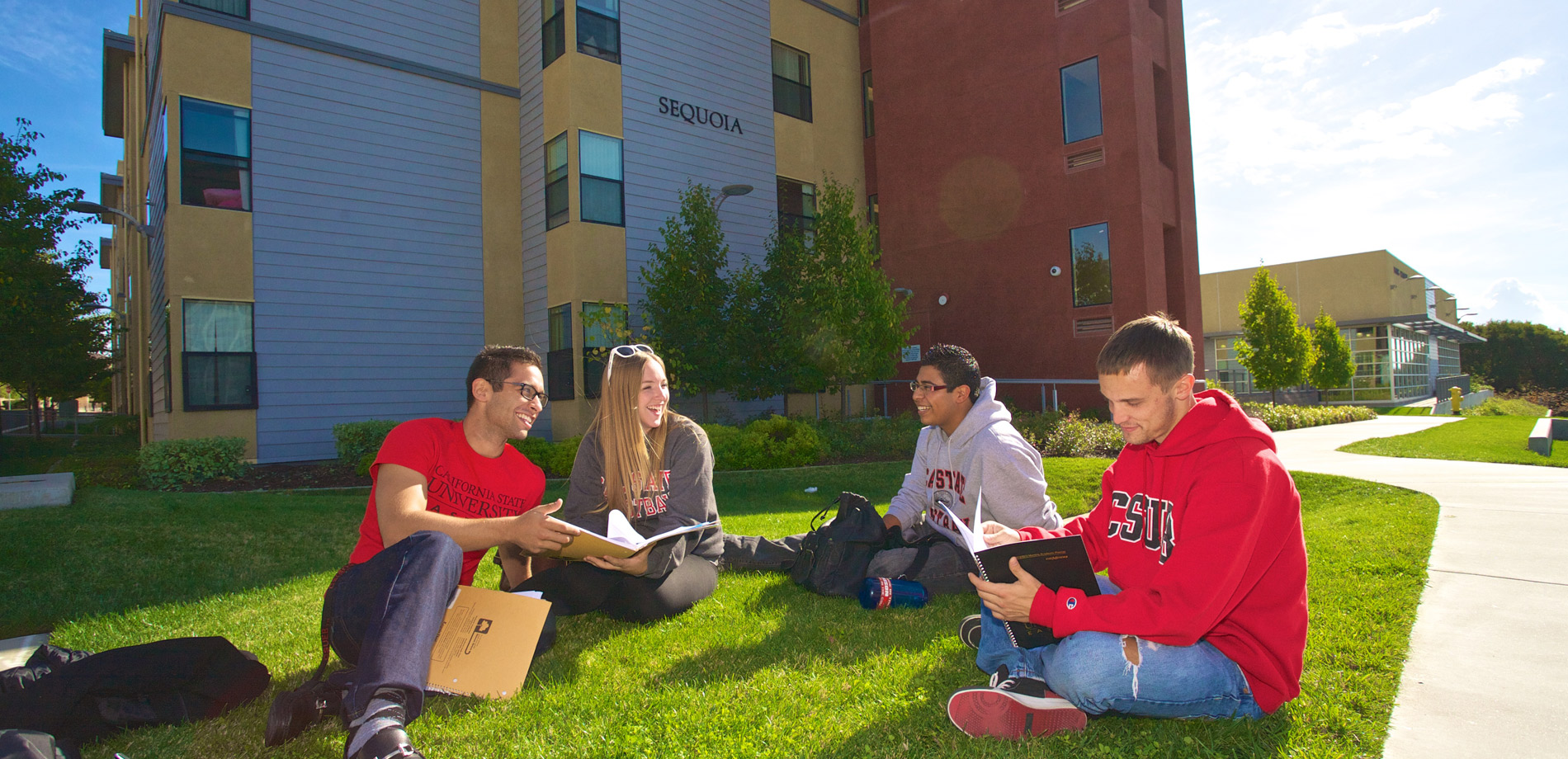 Residents sitting on the grass lawn