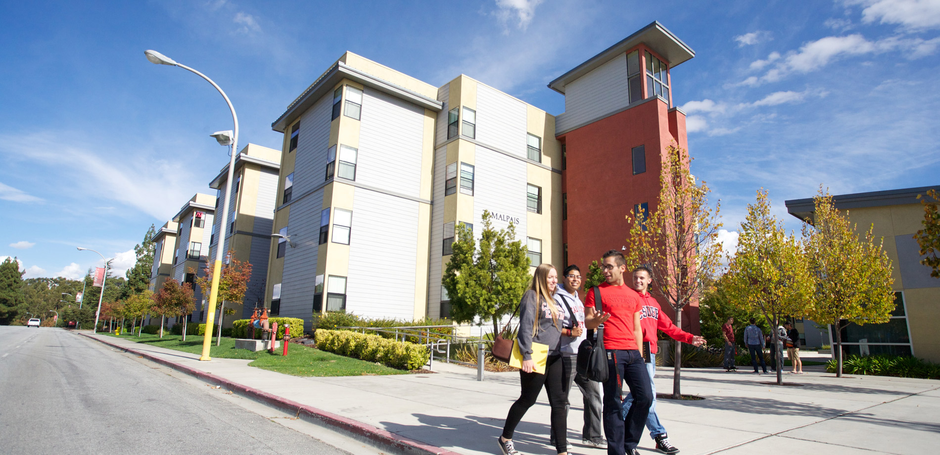 Residents walking along the sidewalk