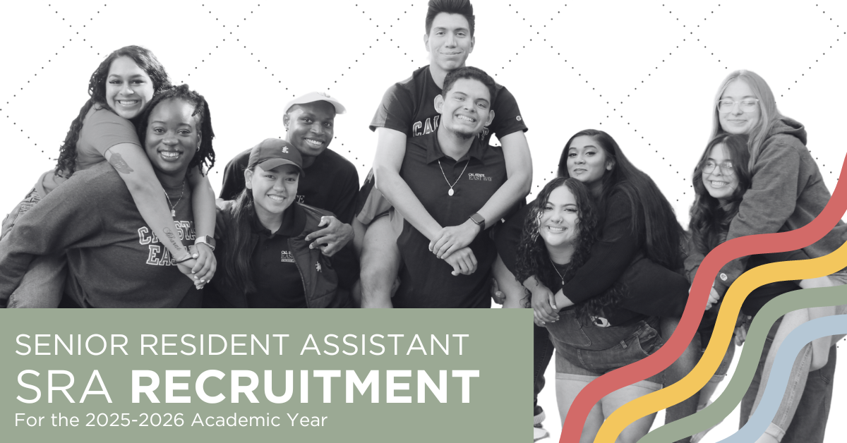 Picture of 4 student leaders wearing Cal State East Bay apparel standing in front of a residence hall with their arms around each other and laughing.
