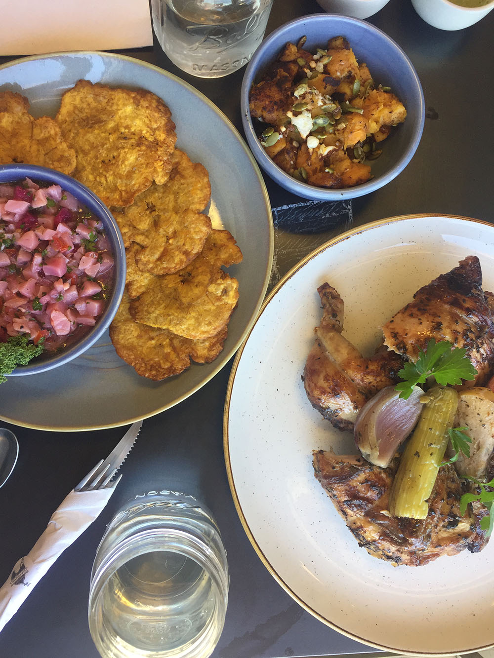 Several plates of Latin-American food on a table