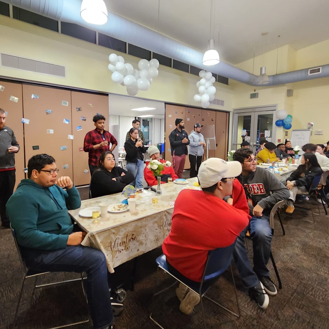 Student and Staff listening to a meeting