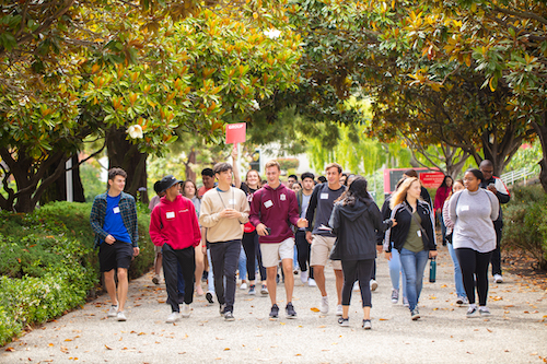 tour guide showing students around campus