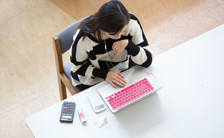 woman looking at her laptop computer