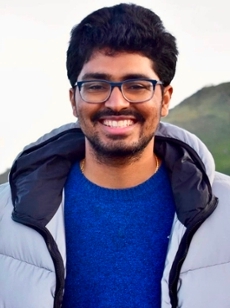 Indian man in front of Golden Gate Bridge