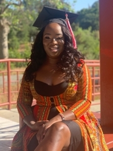 smiling woman in graduation cap