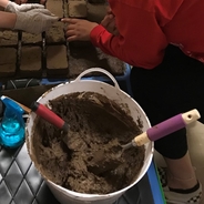 bucket and adobe bricks