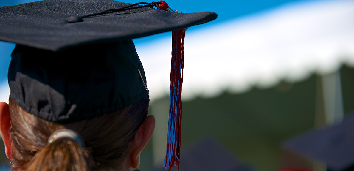 Back of the head of person wearing graduation cap. 