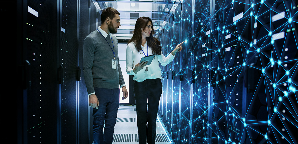 Man and woman walking through a high-tech lab