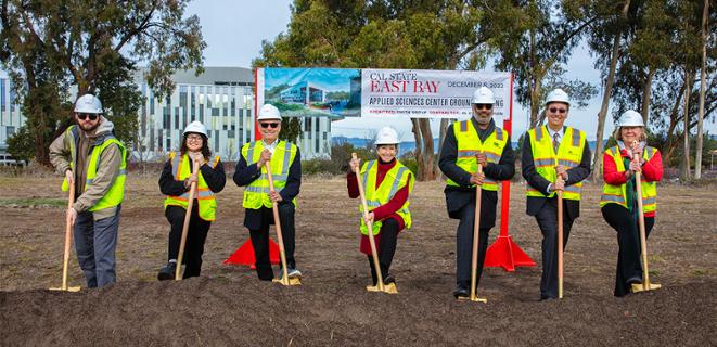 President Sandeen and staff digging the soil in groundbreaking moment