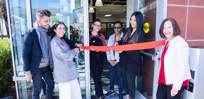 Students and President Cathy Sandeen at resource center ribbon cutting