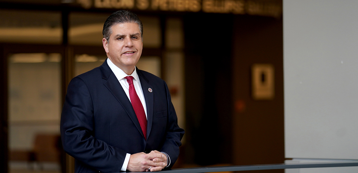 Joseph I. Castro standing in a suit