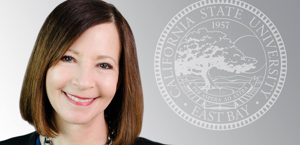 Cathy Sandeen with university seal in background