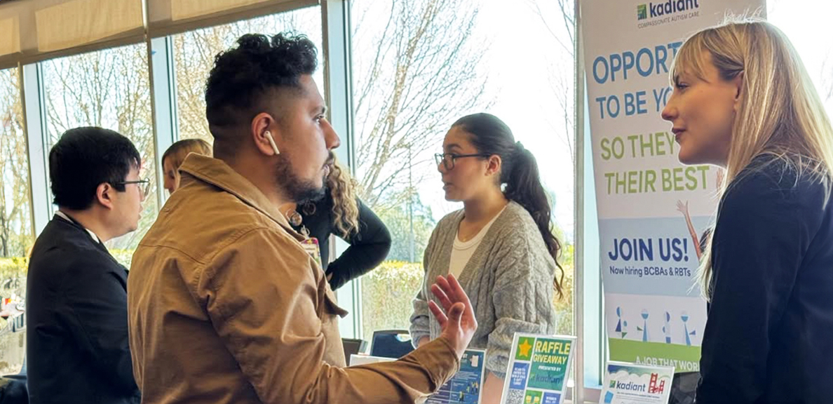 Students speaking to employers at a career fair