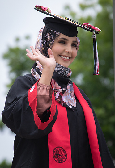 Graduate waves at ceremony