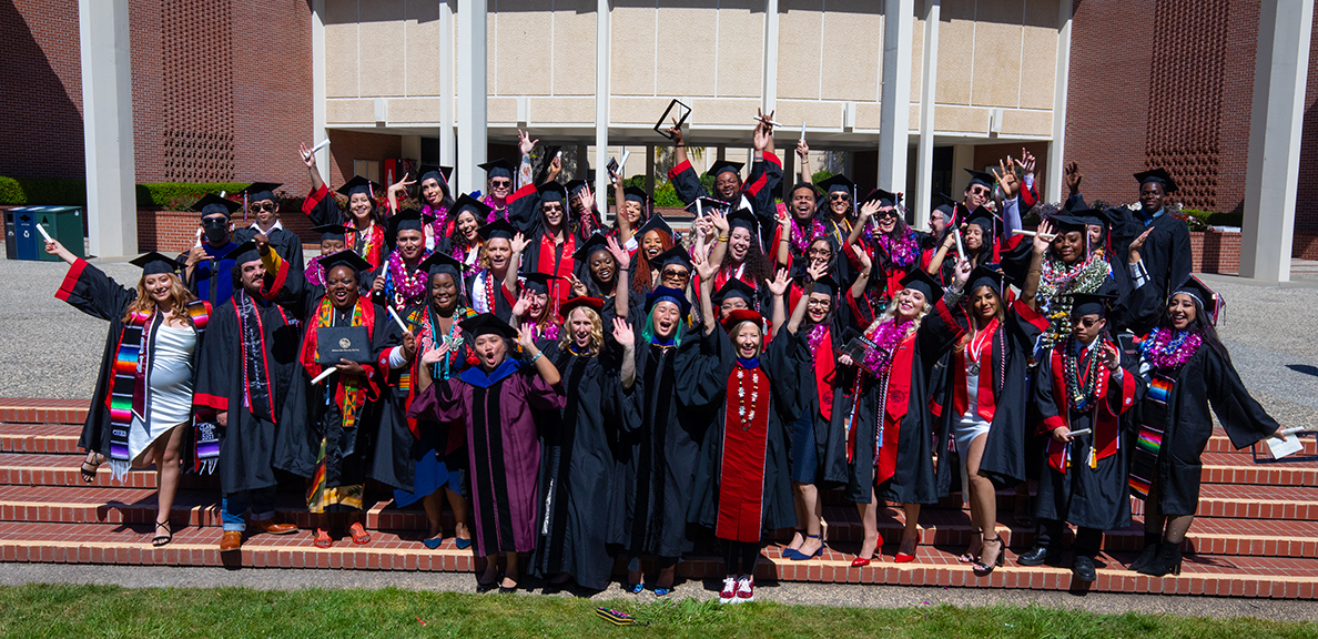 Political Science graduates pose on music building steps