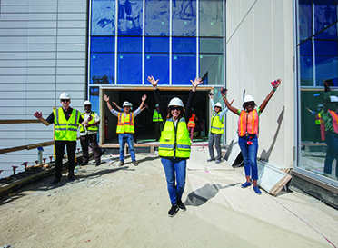 President Sandeen and workers at CORE building construction site