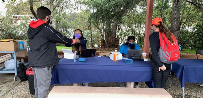 Students line up to get tested at the on-campus test site