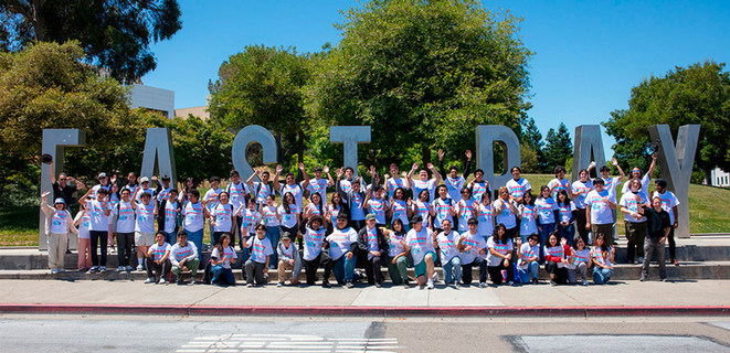 Discover Engineering Camp students in front of East Bay letters monument