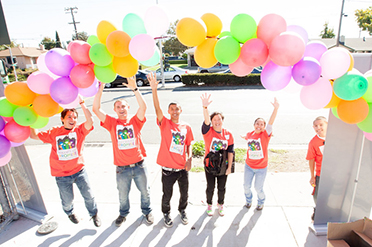 HPN students stand with balloons