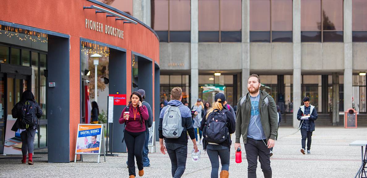 Students walking in front of bookstore