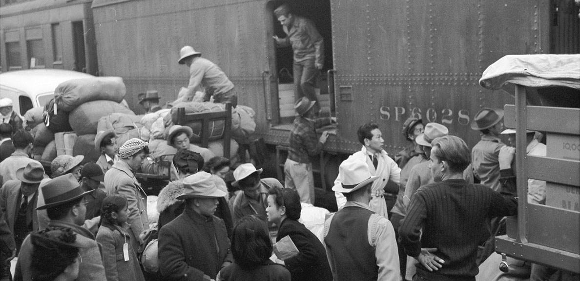 Japanese Americans board a train for an internment camp