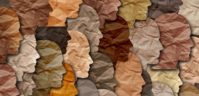 Paper cutouts of faces in all different shades