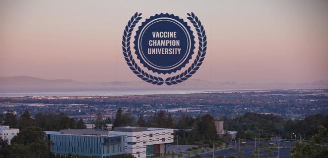 View of CSUEB from above with blue Vaccine Champion University badge