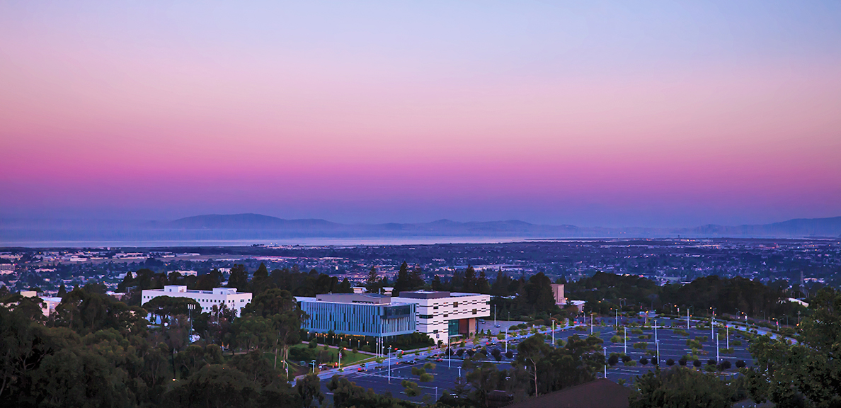 Aerial photo of a purple sunset over East Bay's Hayward campus