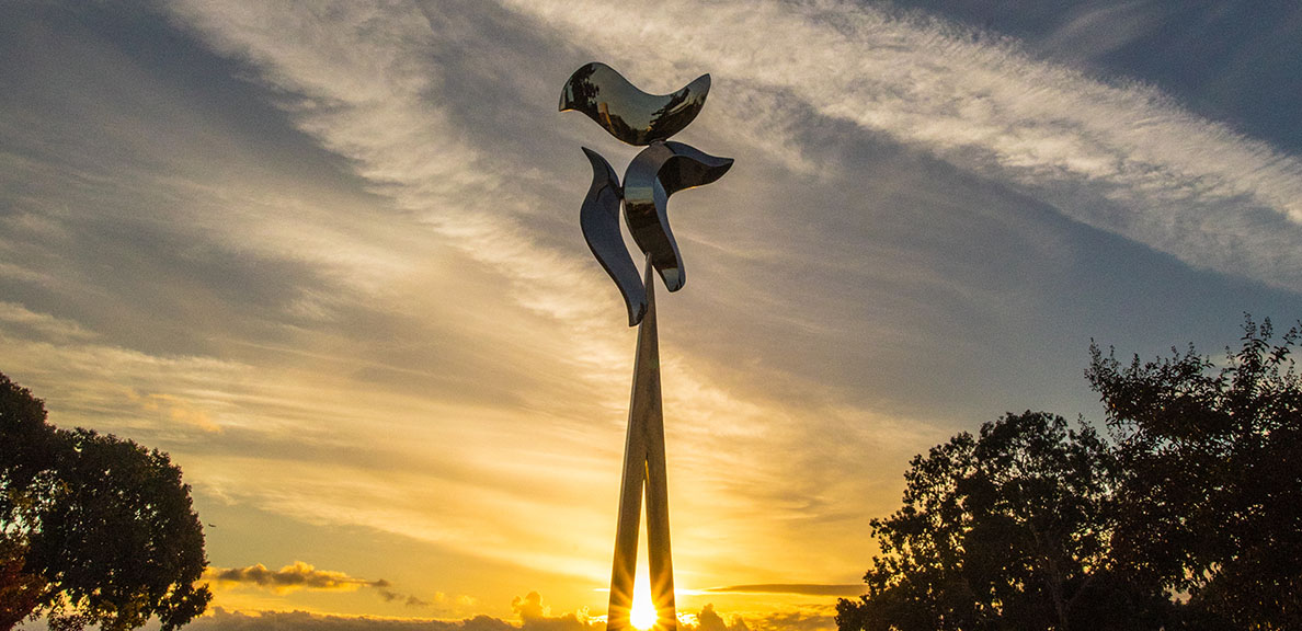 Statue on campus at sunset