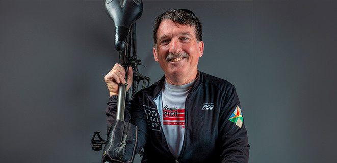 Paul Carpenter holding his bike