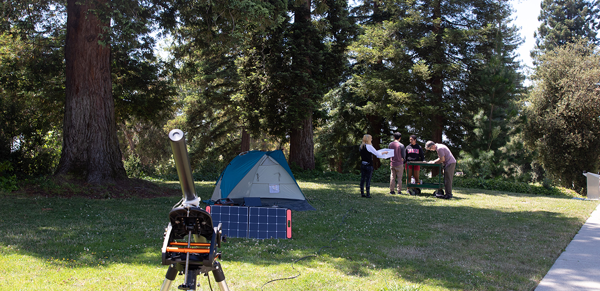 Professor Derek Kimball and three physics students on their camping trip