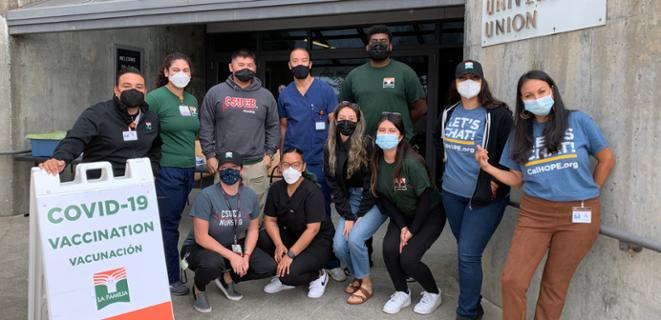 Nursing students help at the on-campus vaccination clinic.