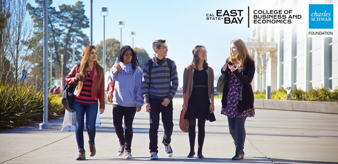 A group of students walking side by side in front of the Valley Business and Technology building
