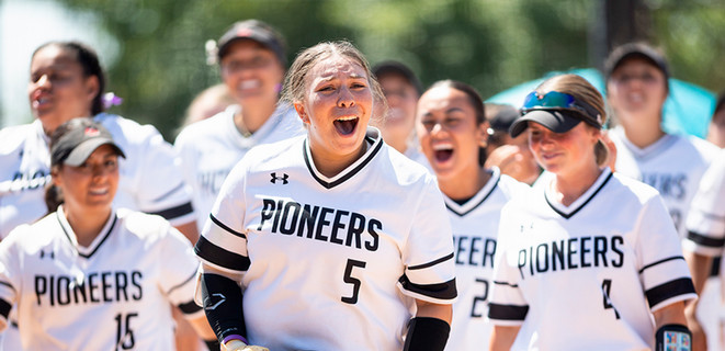 Pioneer Women's Softball team celebrating after win